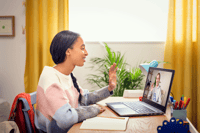 girl at laptop having online tutoring lesson