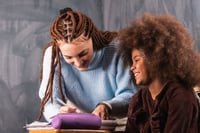 Happy-student-and-tutor-in-a-private-tutoring-lesson