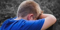 boy crying because of bullying