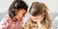 two girls laughing