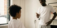 father telling off son