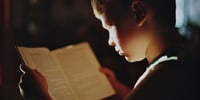boy reading a book