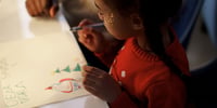 child doing christmas arts and crafts