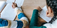 children writing in school