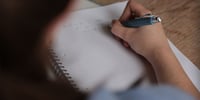 Student doing an a level maths past paper