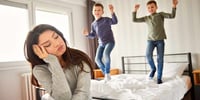 stressed mom looking after kids