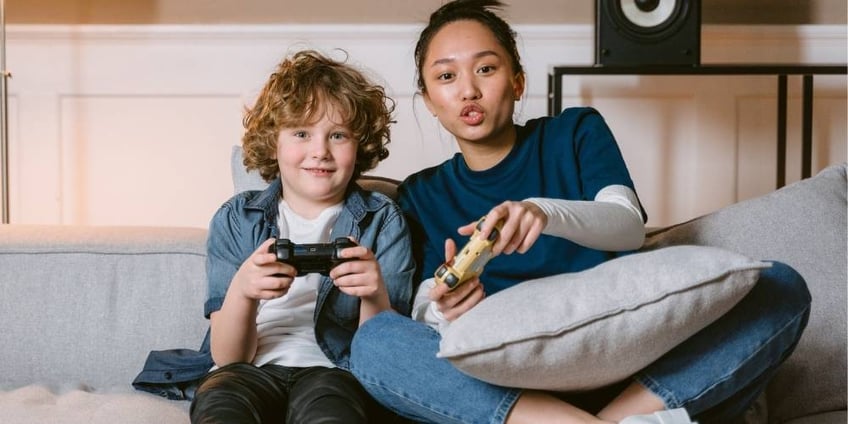 mother son playing esports videogames