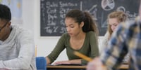 girl studying for exam in classroom