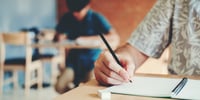 child taking an exam