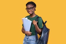 Student-holding-A-Level-results-exam-papers