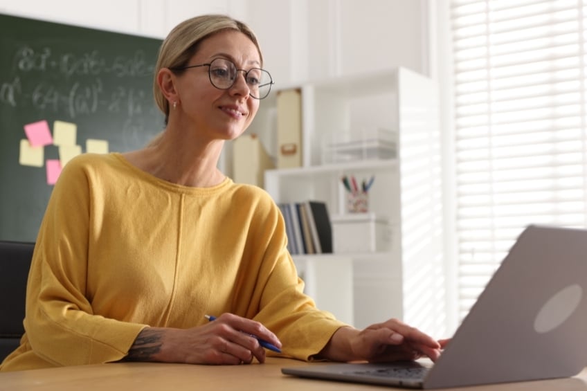 Teacher writing her tutoring advertisement on an online tutoring paltform