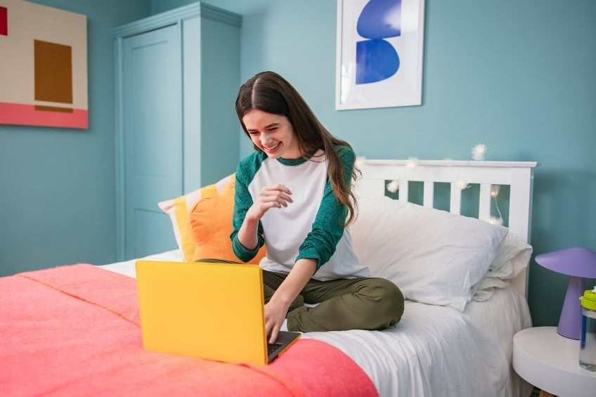 a teenage girl following an online tutoring lesson on gostudent before going back to school