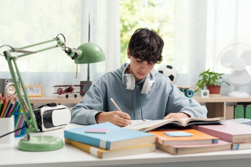 focused young teenager studying to get good grades