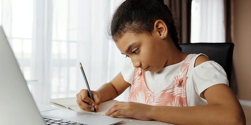 girl_learning_to_write