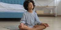 small child meditating