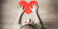 child holding a heart