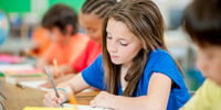 girl writing at school
