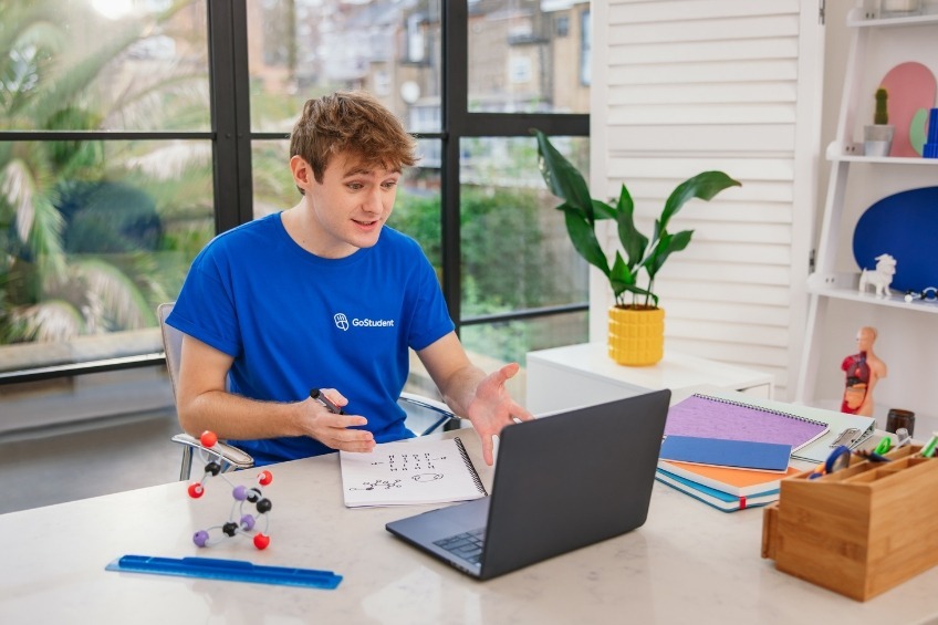 student-summer-job-tutoring-a-chemistry-lesson-online-over-video-call