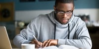 boy studying on a-level revision website