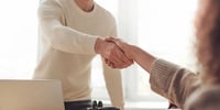 parent shaking hands