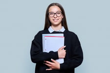 teenage-pupil-glasses-hugging-notebooks-for-gcses-exams