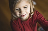 multilingual child looking at a screen