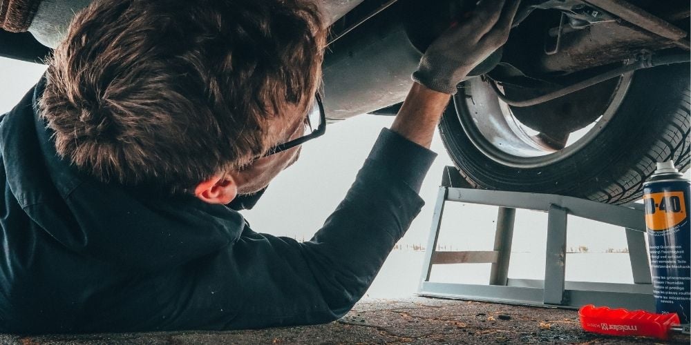teenager doing mechanic apprenticeship
