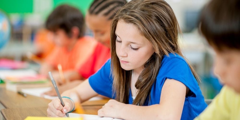 girl writing at school